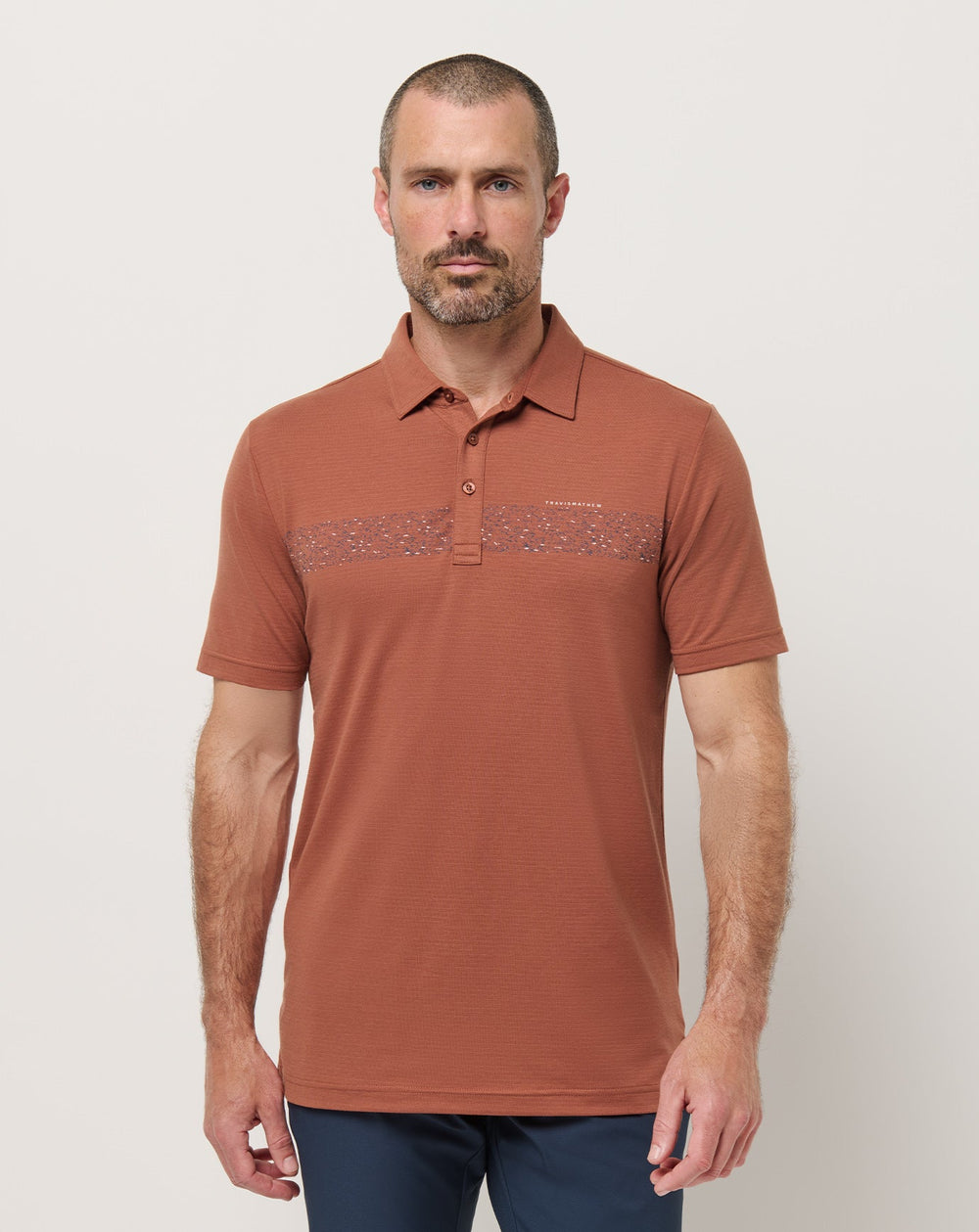 The Heater Chest Stripe Polo| Travis Mathew
