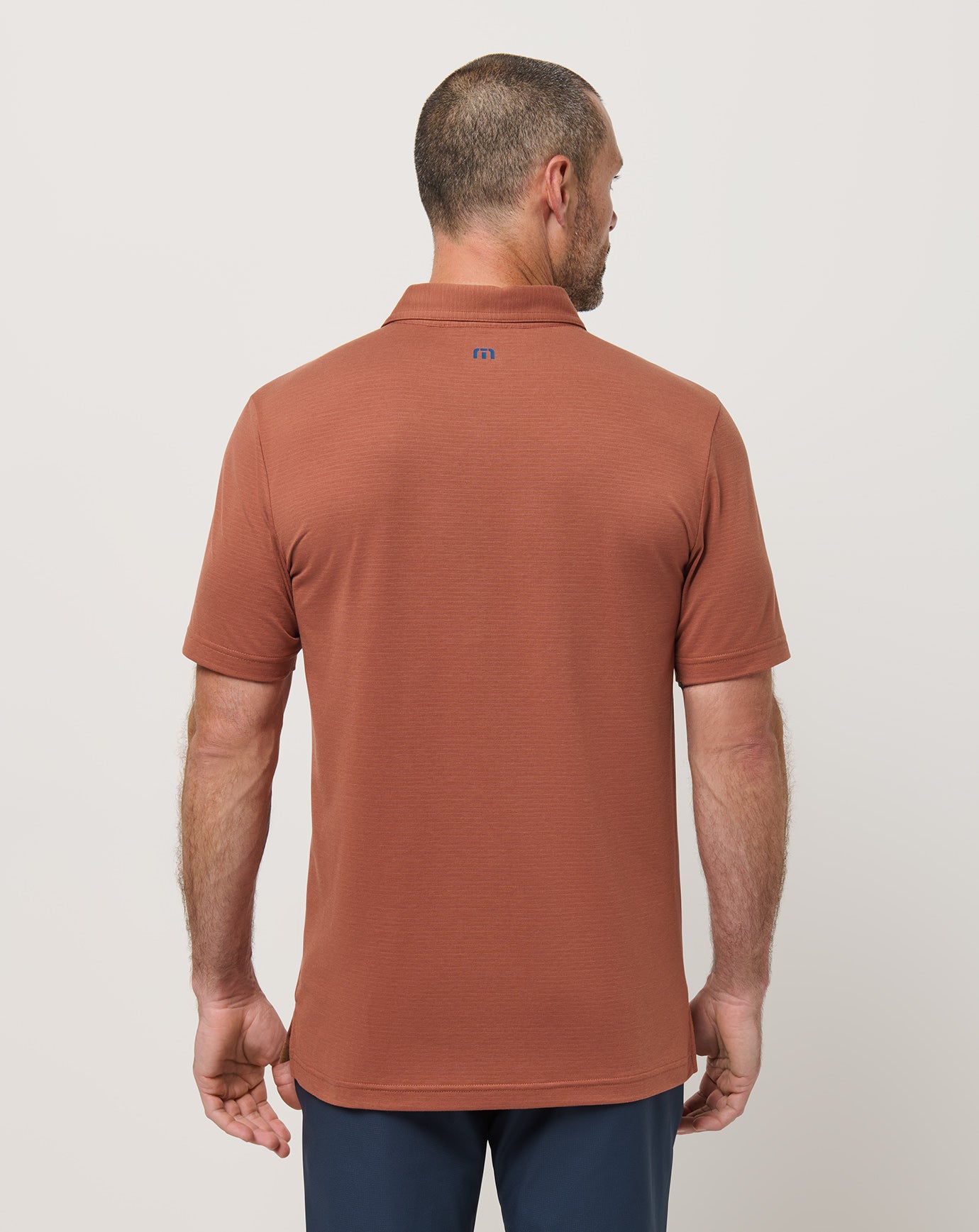 The Heater Chest Stripe Polo| Travis Mathew