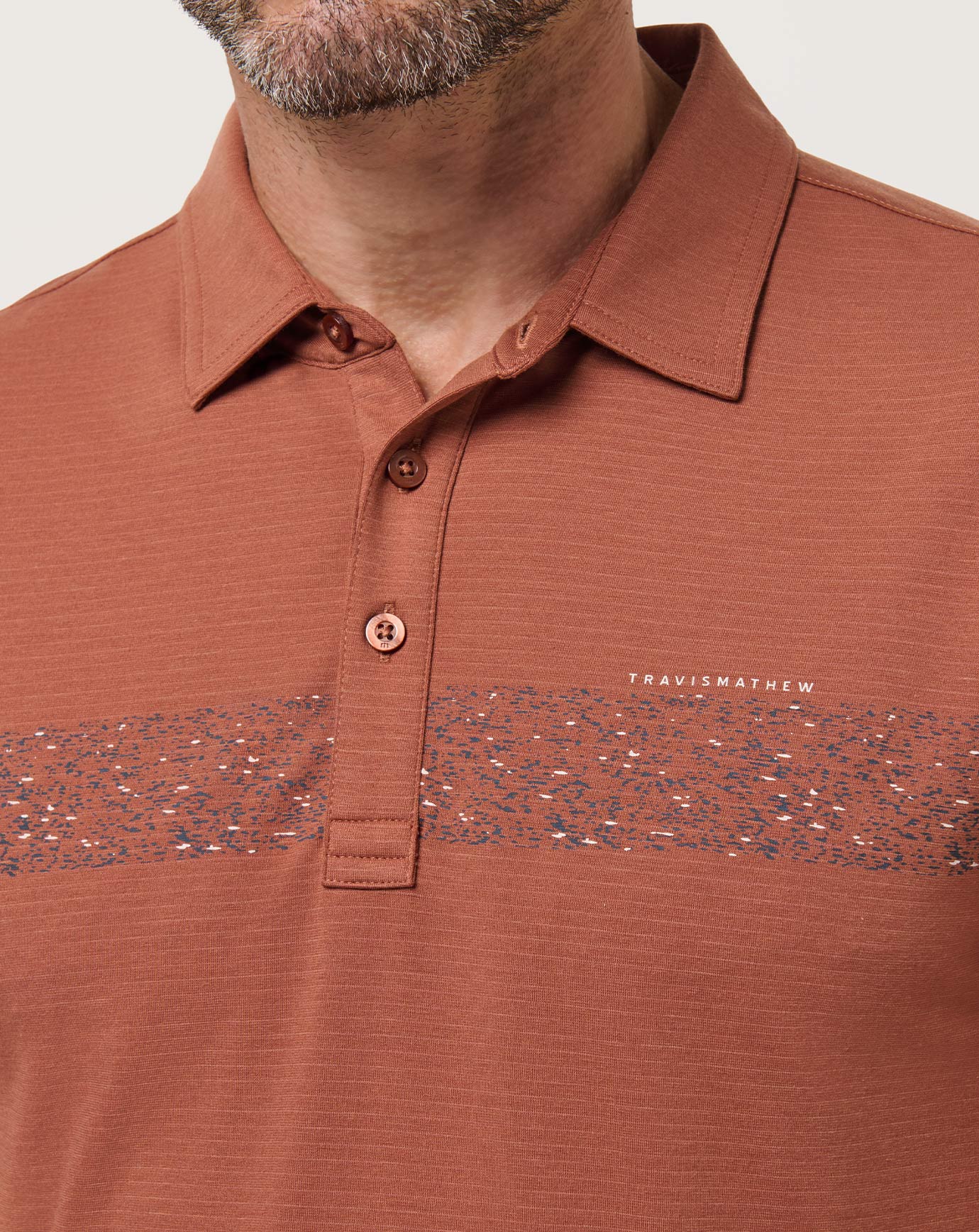 The Heater Chest Stripe Polo| Travis Mathew