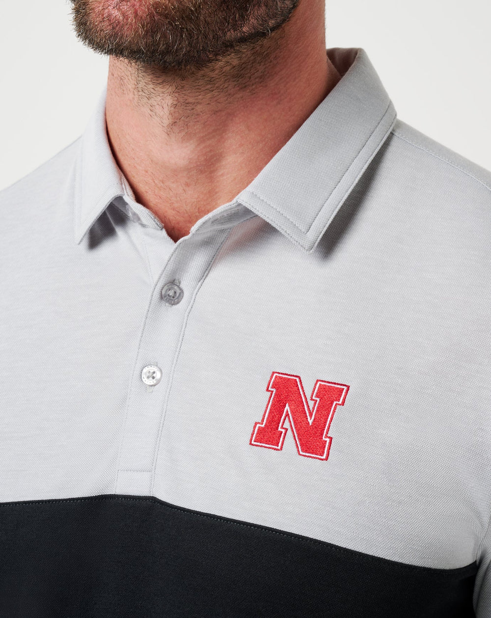 Nebraska Drop Back Polo| Travis Mathew